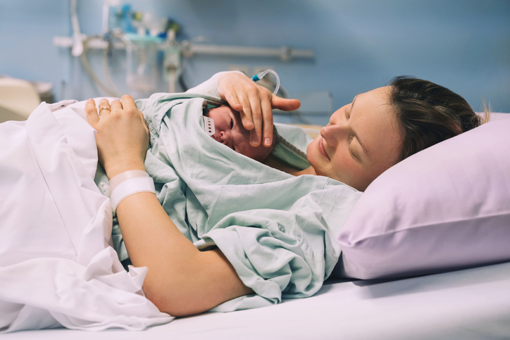 woman with her newborn in the hospital