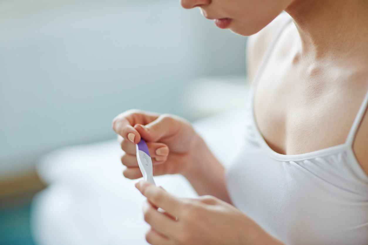 woman waiting for the results of her at-home pregnancy test