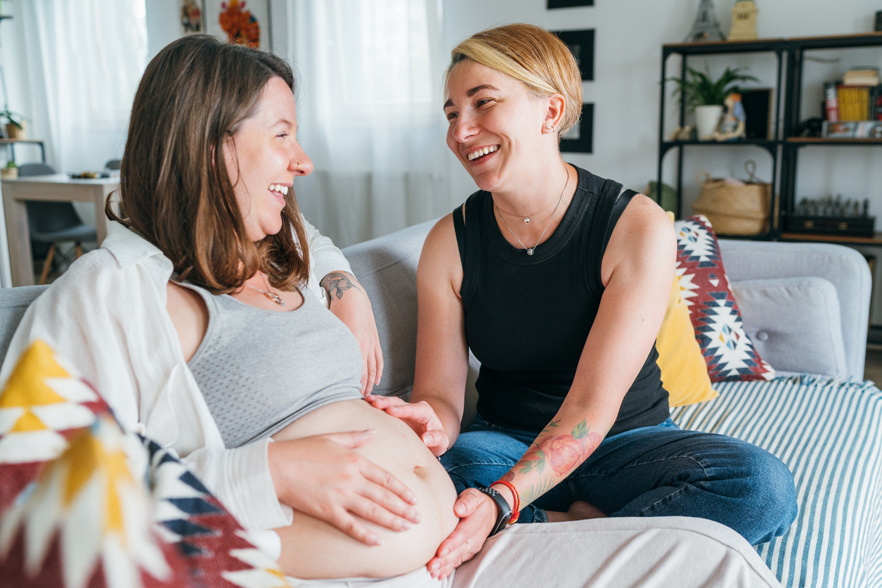 pregnant woman spending time with her best friend