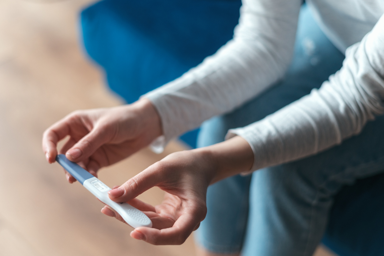 woman waiting for results of an at-home pregnancy test