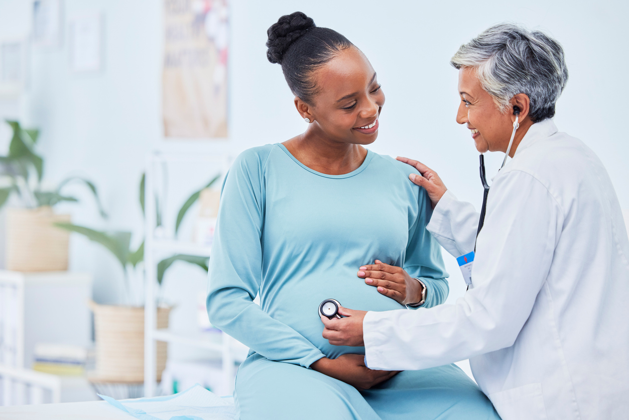 pregnant woman having a prenatal checkup with her obgyb