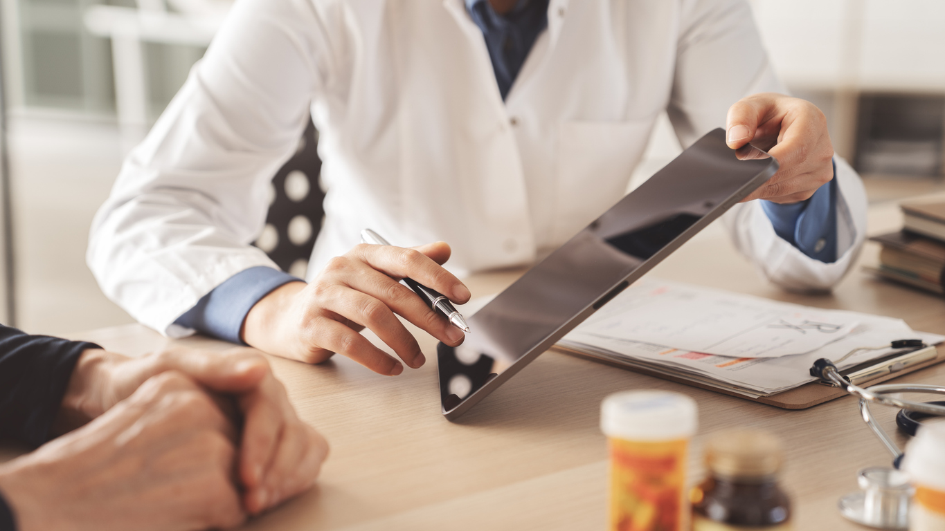 fertility specialist discussing ivf financing with prospective client