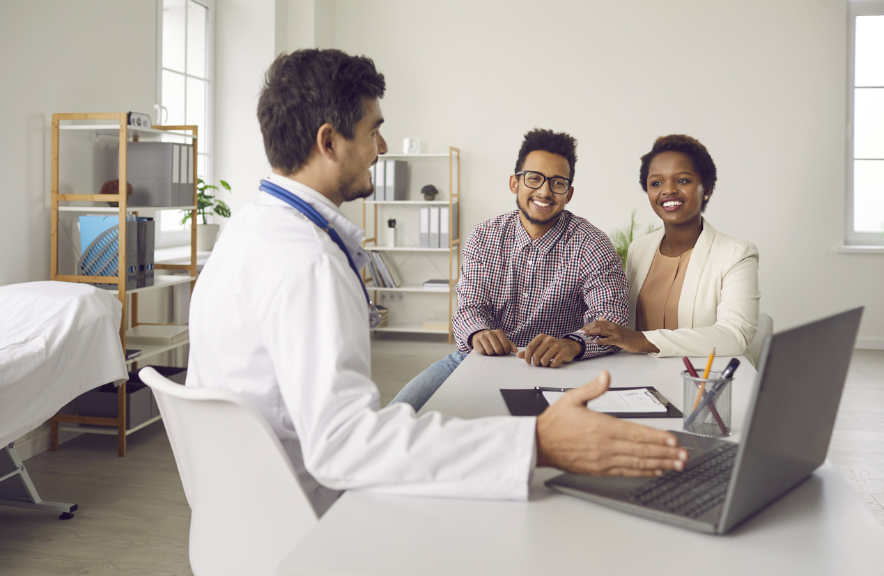 couple discussing ivf financing with counselor