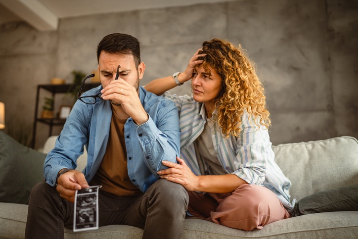 pregnant couple in distress
