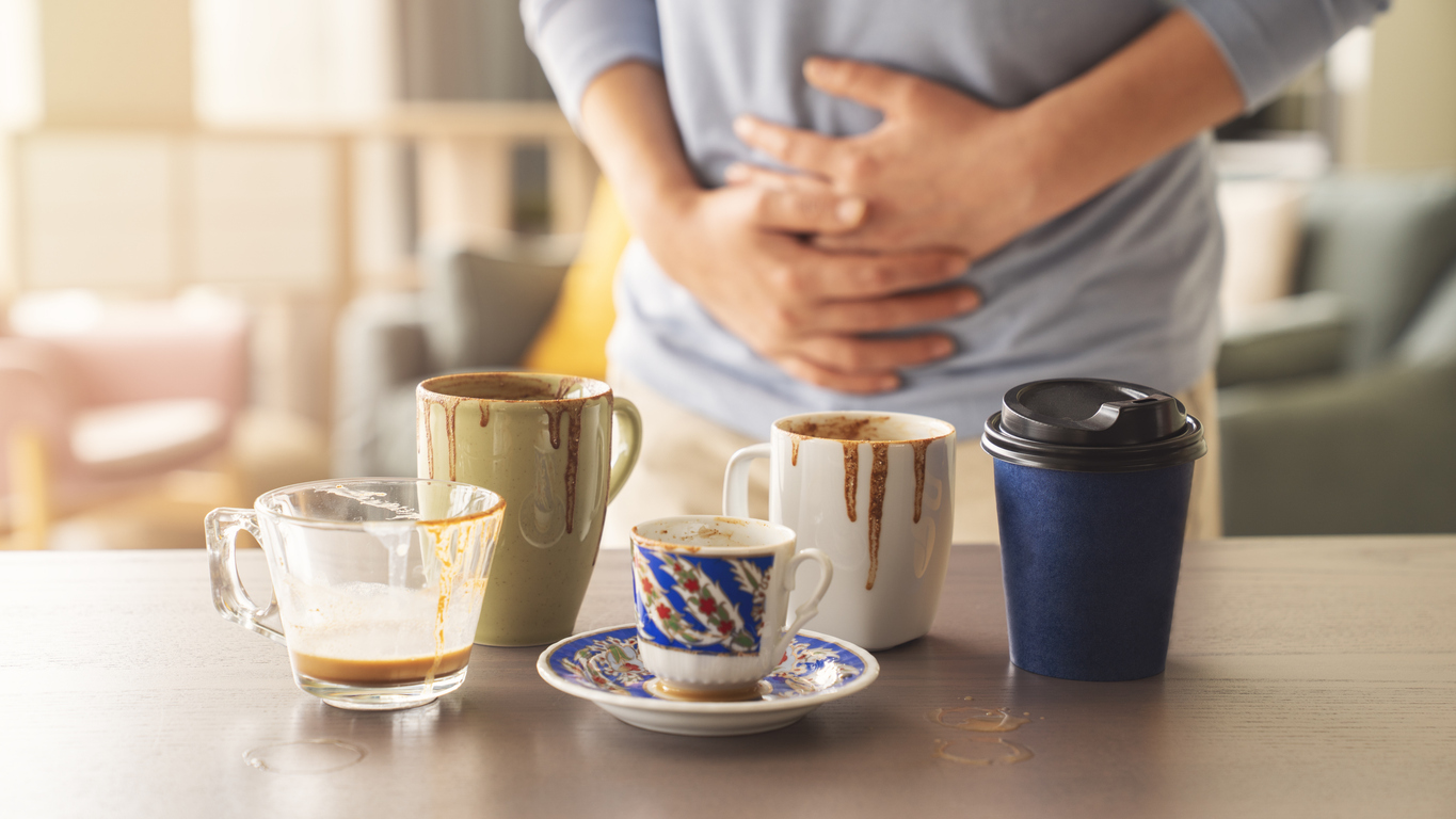 woman suffering from digestive issues due to coffee