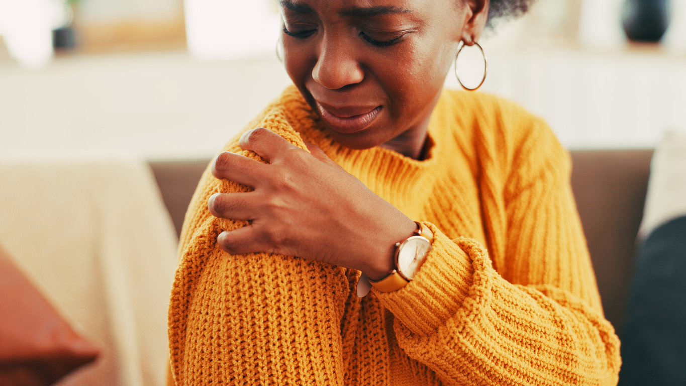 menopausal woman having pain from frozen shoulder
