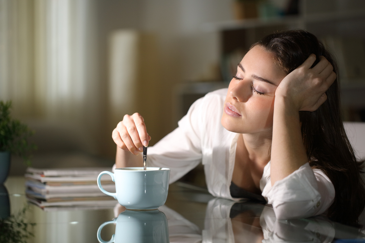 woman in her twenties feeling sluggish due to second puberty