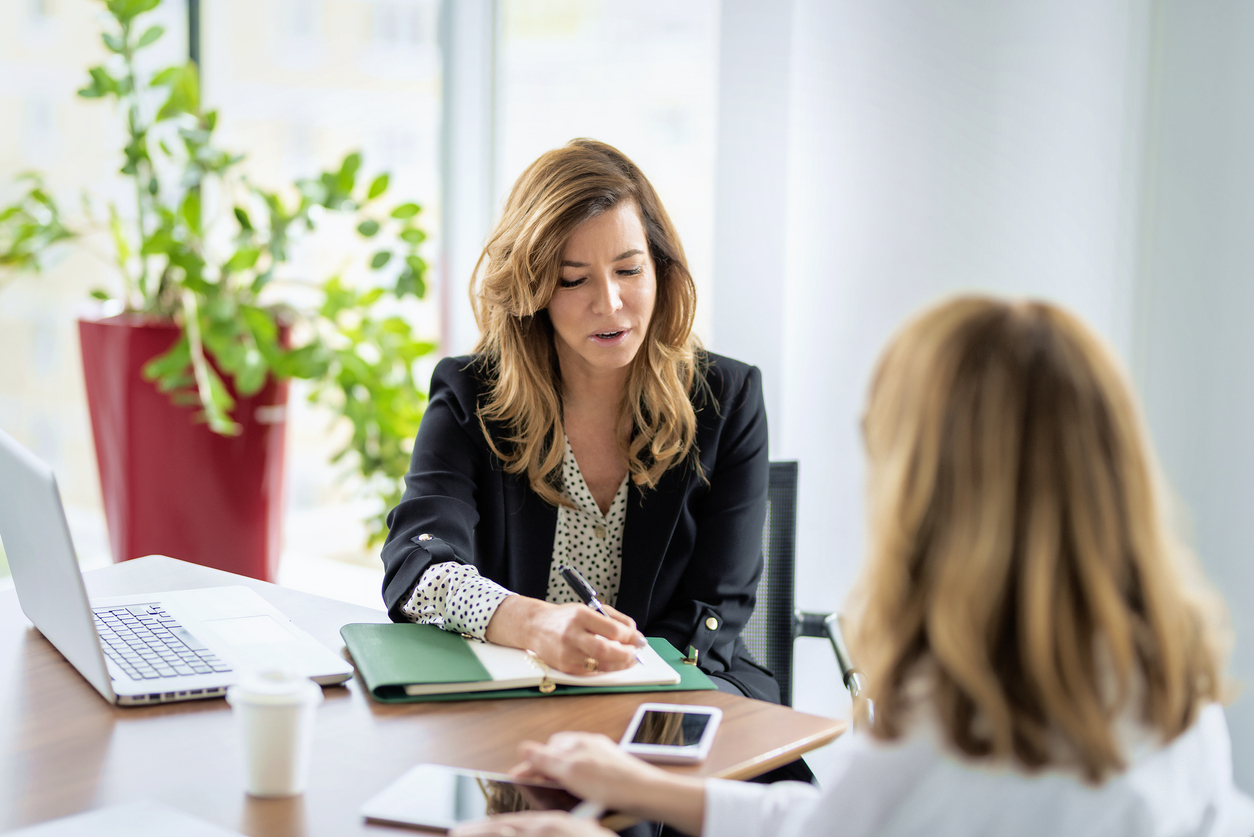woman working with financial planner to afford ivf