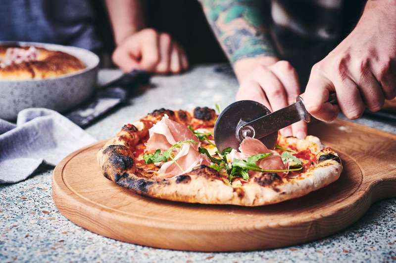 Slicing Dough & Glory pizza