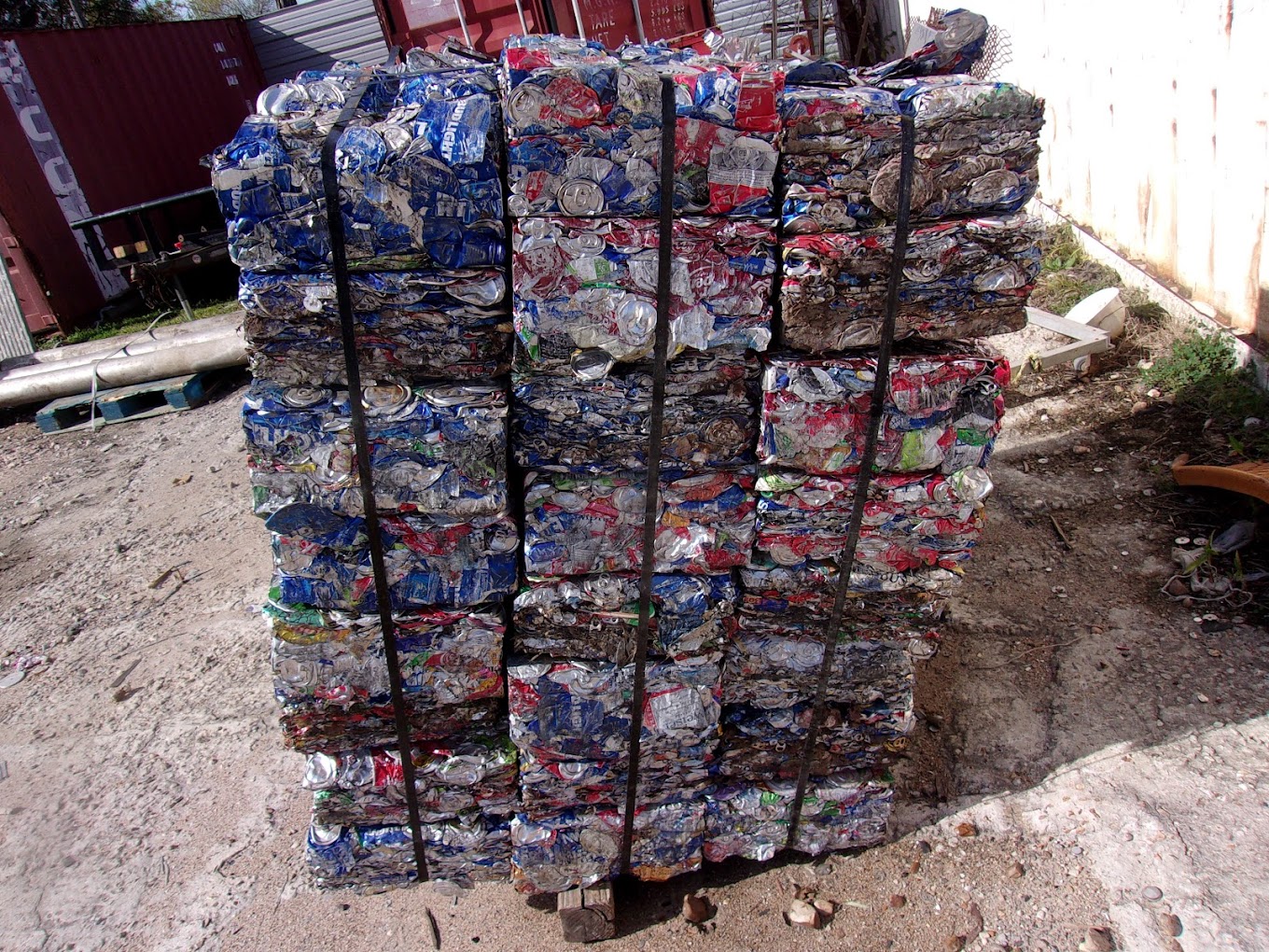 compacted cans strapped together for recycling