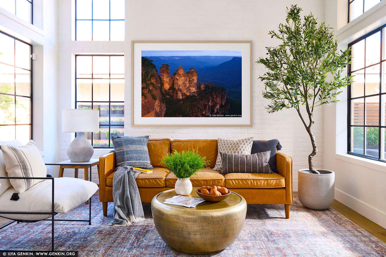 The Three Sisters wall art in a minimalist living room interior