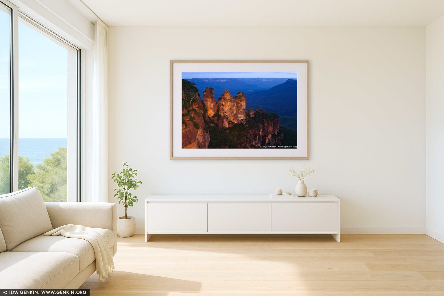The Three Sisters wall art in a minimalist living room interior