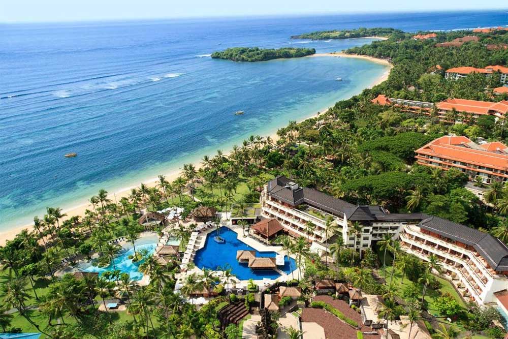 Over the years, the hotel has hosted kings and queens, presidents, and other luminaries. Each guestroom is designed with classic Balinese furnishings and provides breathtaking views of groomed tropical gardens or ocean panoramas from the terrace or balcony, making this hotel ideal for a Bali couple package.