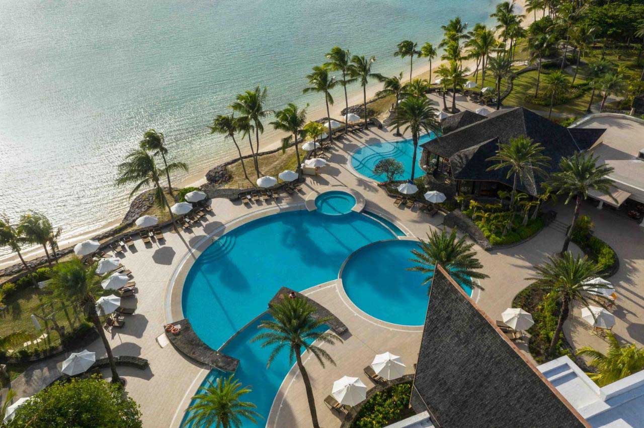 The Residence Mauritius in Belle Mare, offering Mauritius packages including flights, showcases its elegant beachfront setting.
