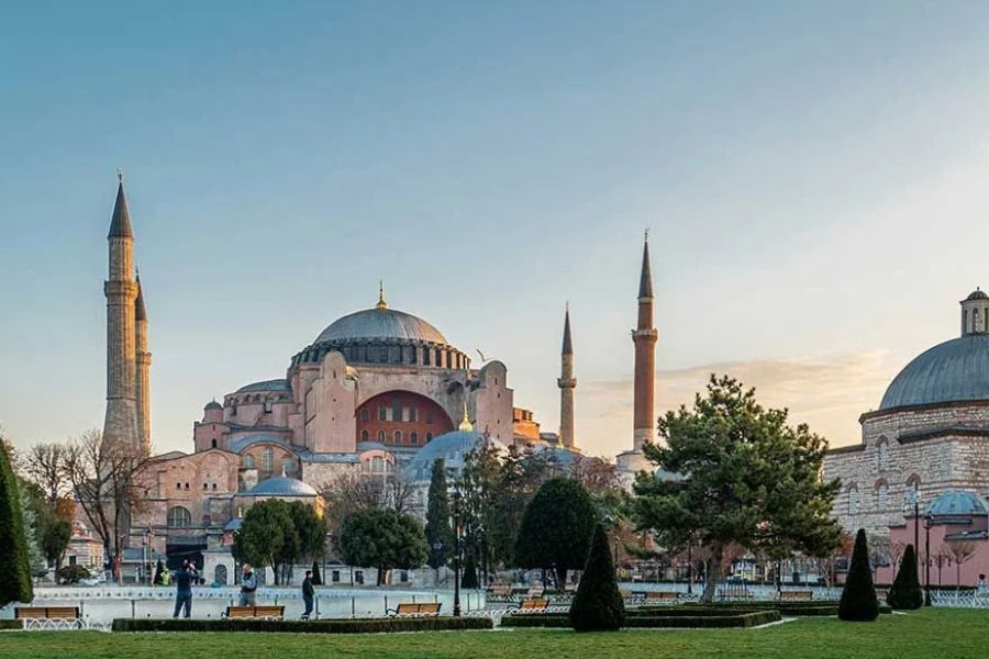 Hagia Sophia's dome and minarets at dusk, seen from the park in front