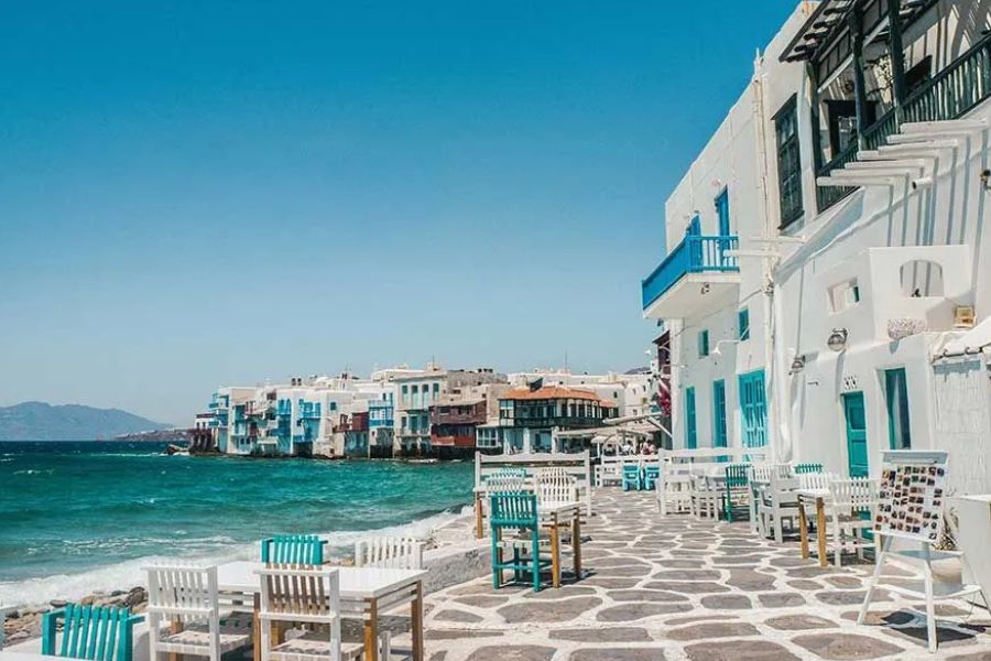 Mykonos's Little Venice waterfront, white buildings with colorful balconies over the sea