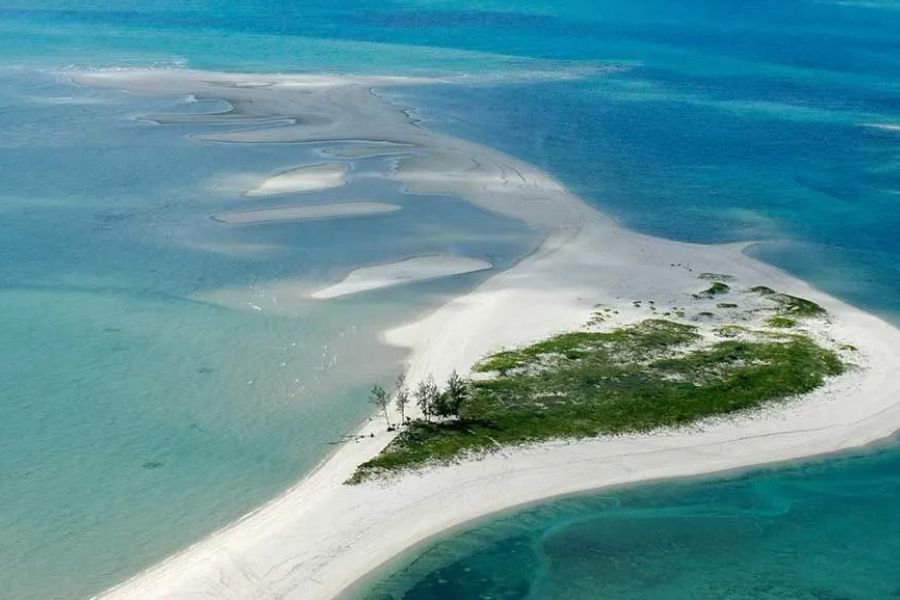 Aerial view of pristine sandbanks surrounded by Mozambique’s turquoise ocean.