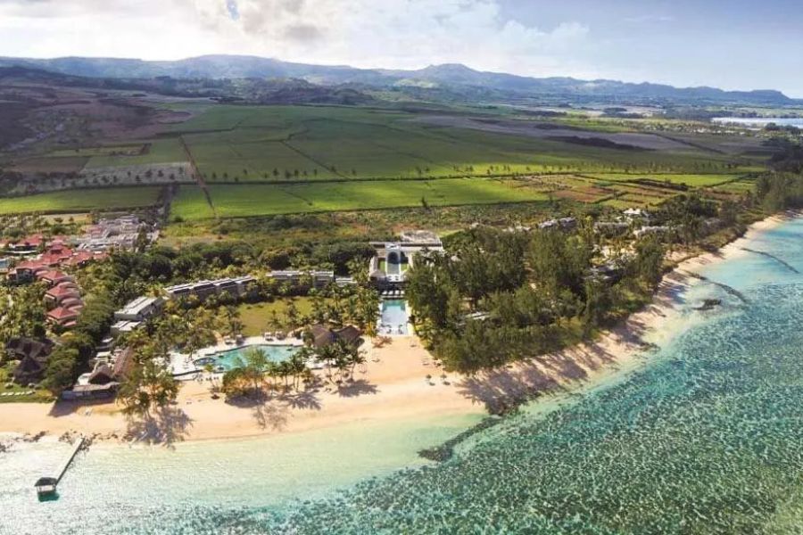 Aerial view of a beachfront resort and turquoise lagoon in Mauritius.