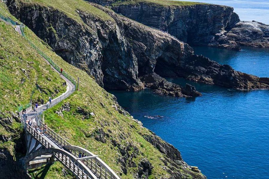 Coastal cliff walk overlooking the Atlantic Ocean in Ireland.