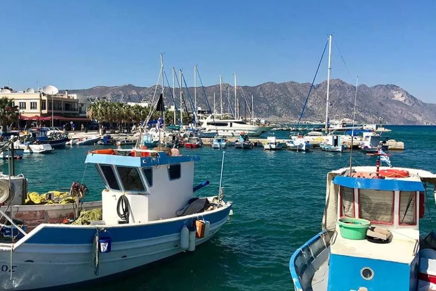 Traditional fishing boats in a Greek island harbour.