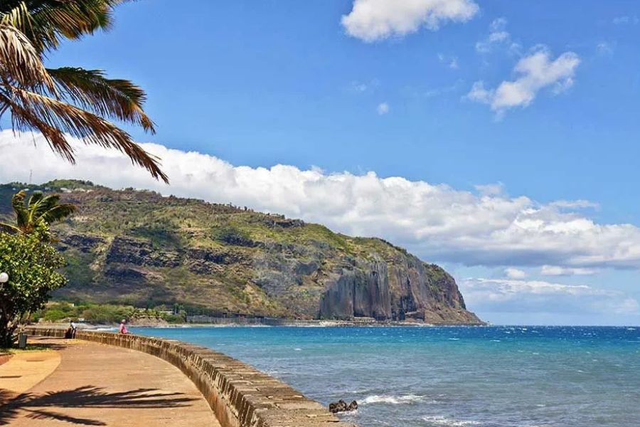 Coastal promenade with volcanic cliffs and ocean views on Réunion Island