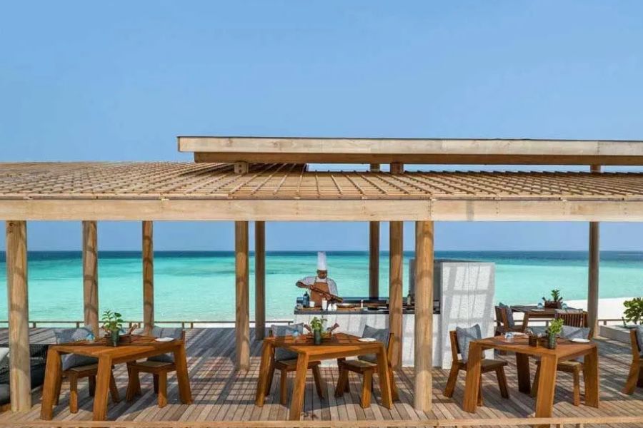 Open-air Maldives dining terrace with uninterrupted views of the Indian Ocean