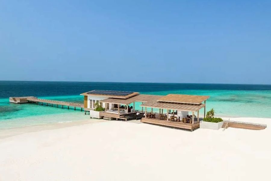 Luxury beach restaurant overlooking the turquoise lagoon in the Maldives