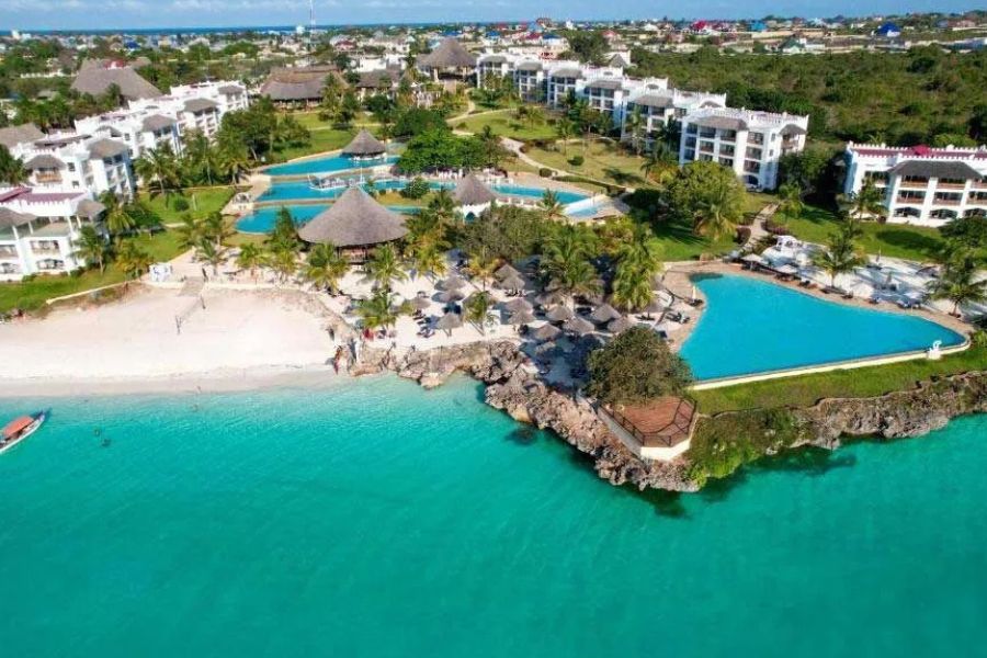 Aerial view of a luxury Zanzibar resort with pools and a private beach.