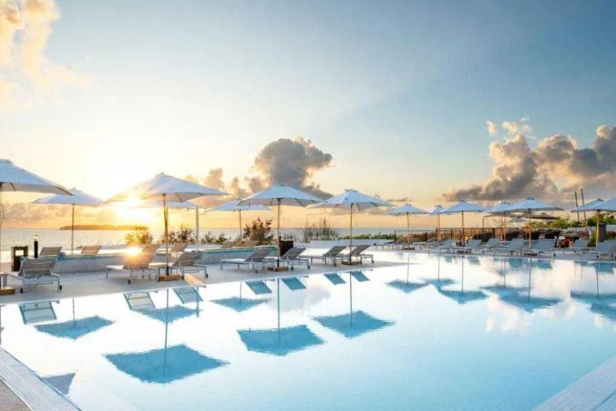 Luxury infinity pool overlooking the ocean at a Zanzibar beach resort.