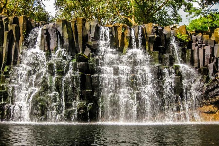 Rochester Falls cascading over volcanic basalt rocks in Mauritius.