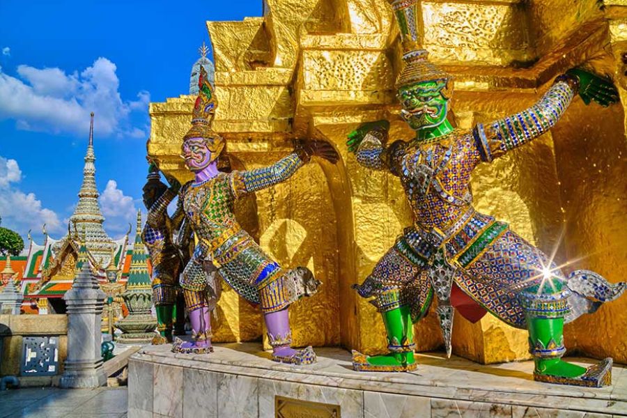 Golden temple spires against a blue sky, Bangkok