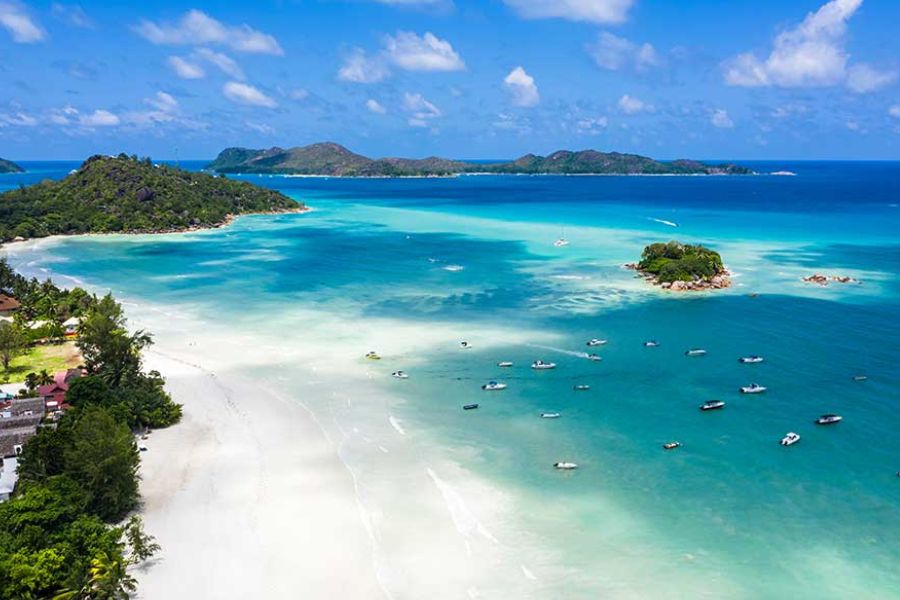 Aerial view of a Seychelles island and its surrounding reef