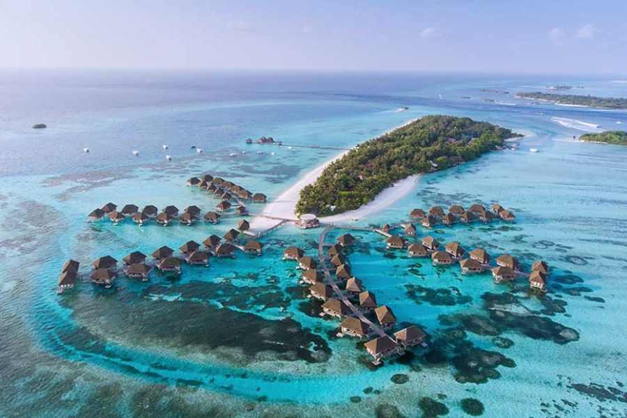 Overwater villas and turquoise lagoon in a Maldives atoll
