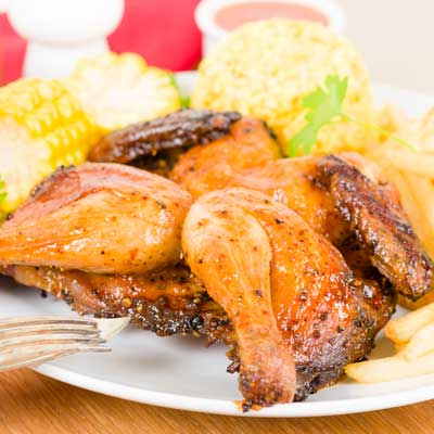 Grilled piri-piri chicken served with corn