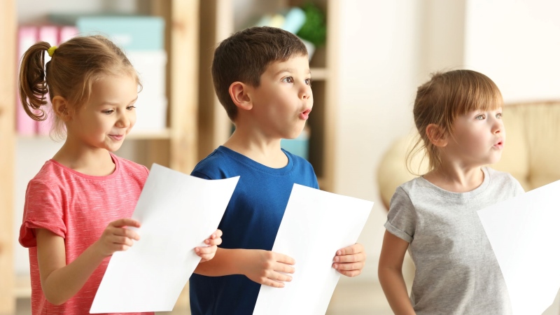 Happy children receiving voice singing lessons with Colette Webb