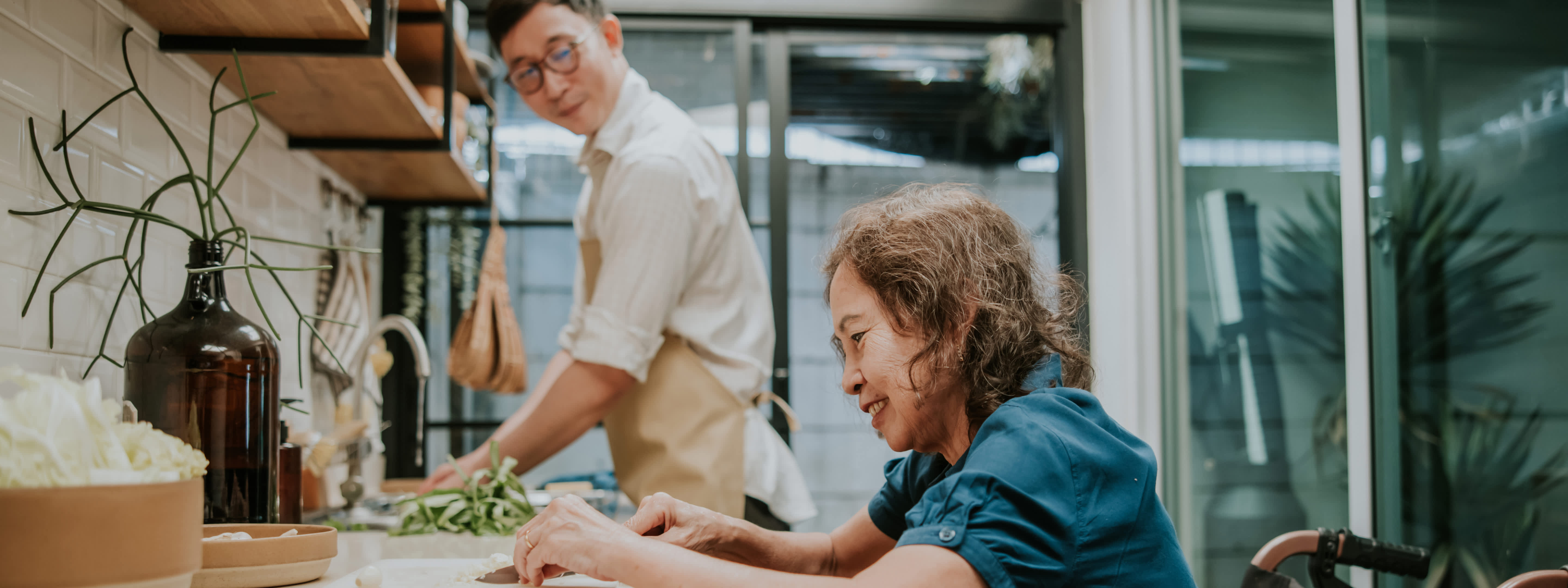 Son helps his mom cooking
