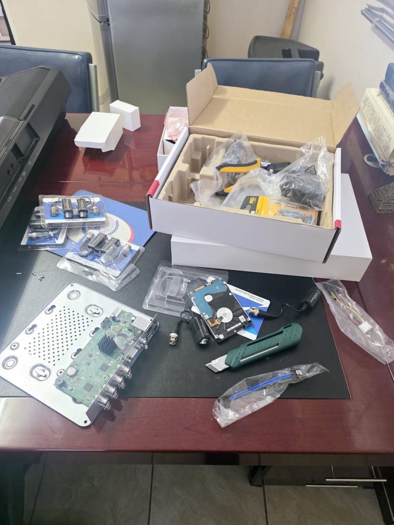 Preparing CCTV components, recording equipment, storage, connectors, and installation accessories before deployment.