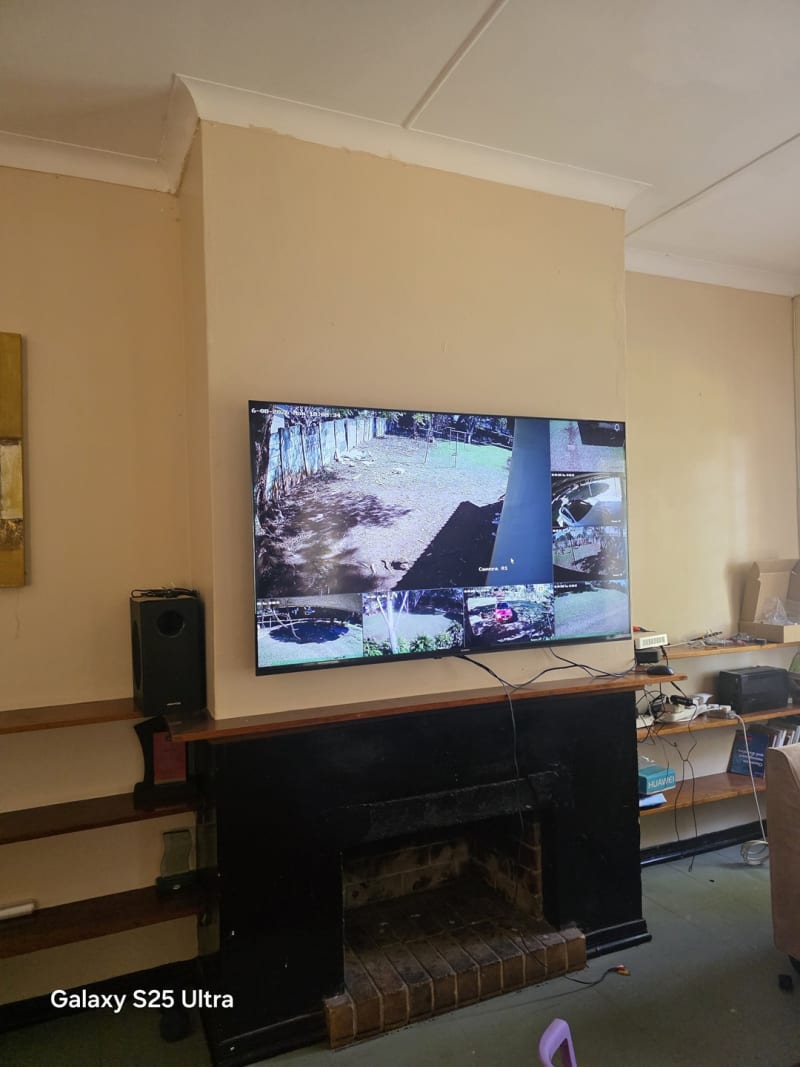 The completed CCTV system displaying multiple live camera feeds on a central monitor