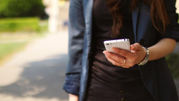 girl holding phone