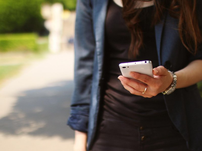 girl holding phone