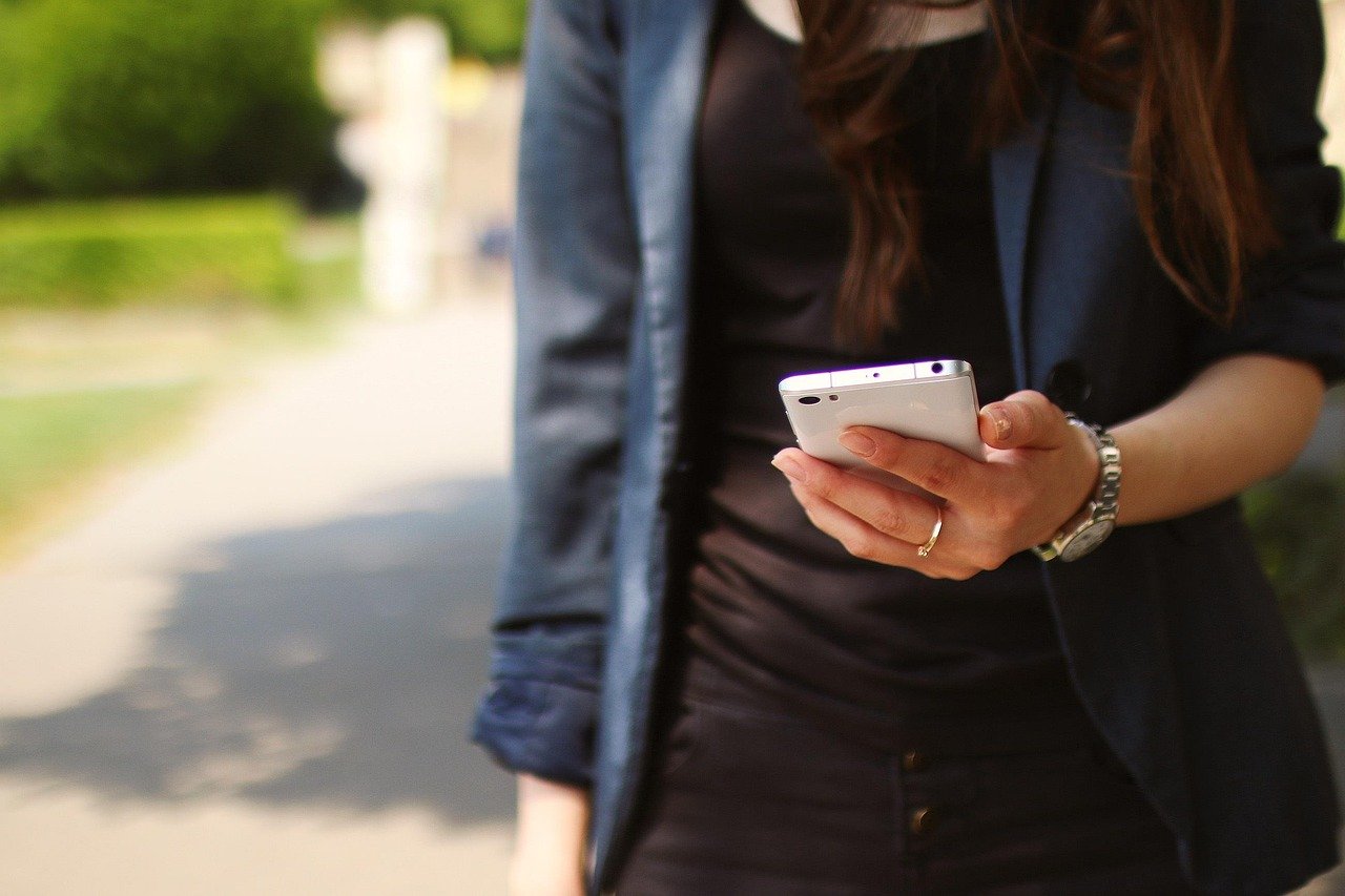 girl holding phone