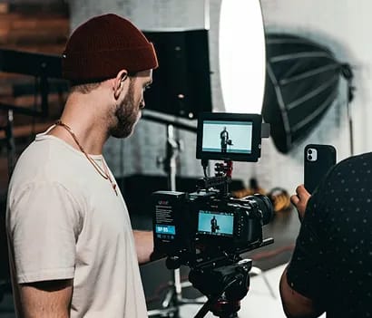 Bridesmaids holding white floral bouquets in blush pink dresses