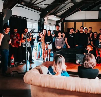 Close-up of couple holding hands in traditional wedding attire with bouquet