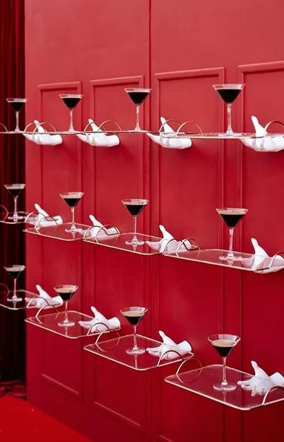 Bridesmaids holding white floral bouquets in blush pink dresses