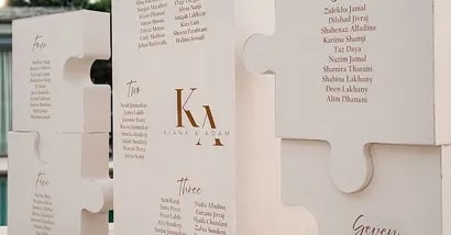 Bride and groom kissing in snow at a winter wedding