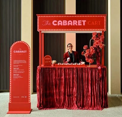 Close-up of couple holding hands in traditional wedding attire with bouquet