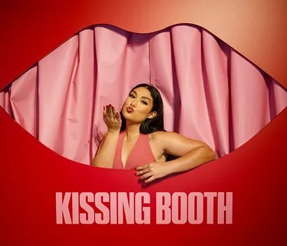 Romantic wedding couple under floral arch setup in outdoor ceremony