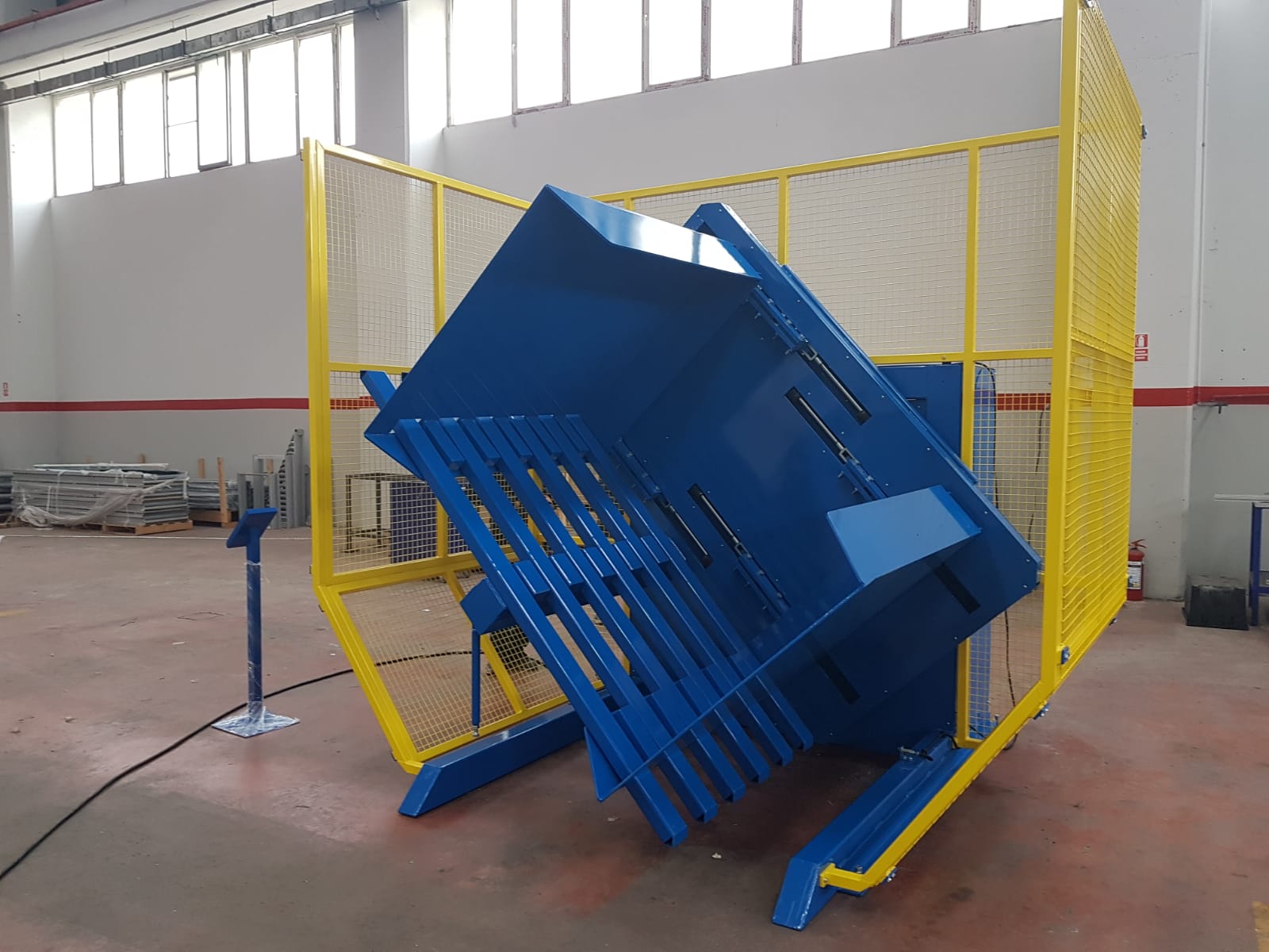 A compact pallet changer with safety fencing, suitable for smaller spaces