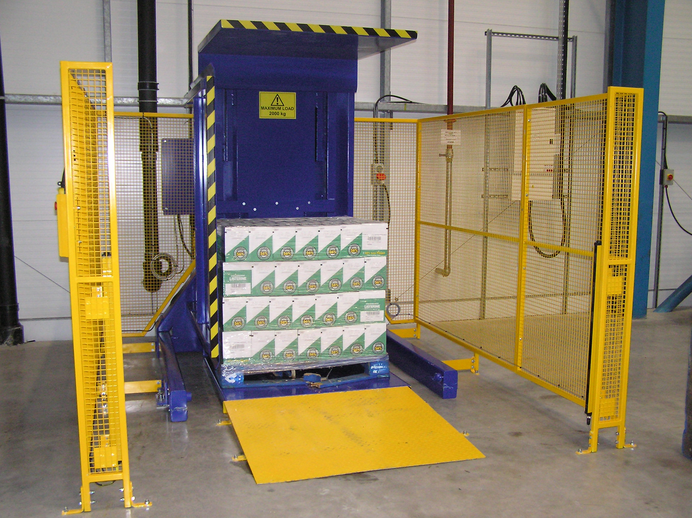 An automated pallet inverter integrated into a production line