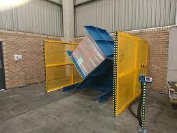 An industrial pallet changer handling heavy loads in a warehouse setting